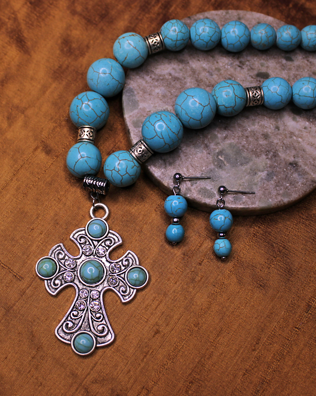 Large silver colored cross with turquoise accents. Large turquoise color necklace. Statement piece. 