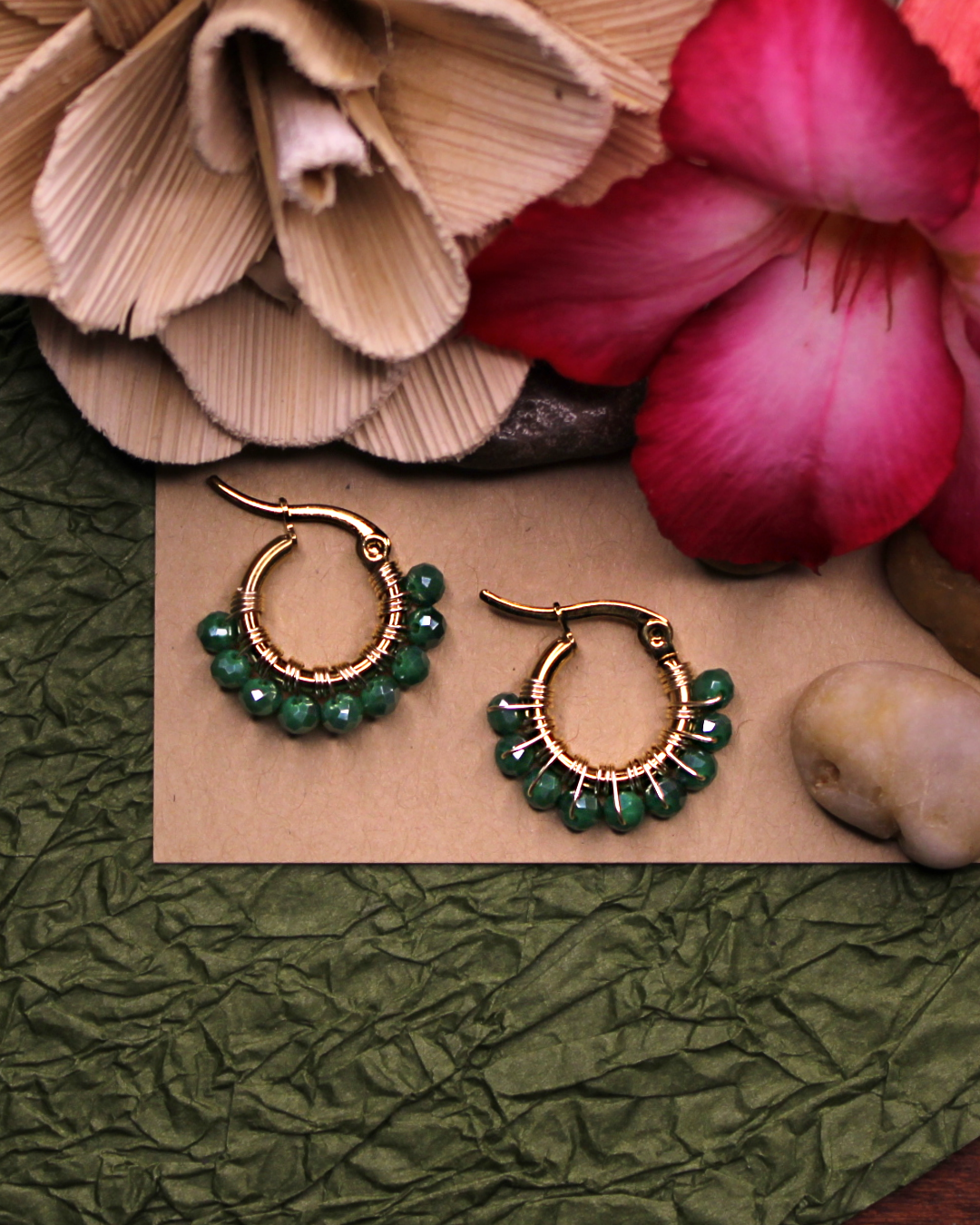 Mini stainless steel gold hoop earrings with forest green crystal beads. 