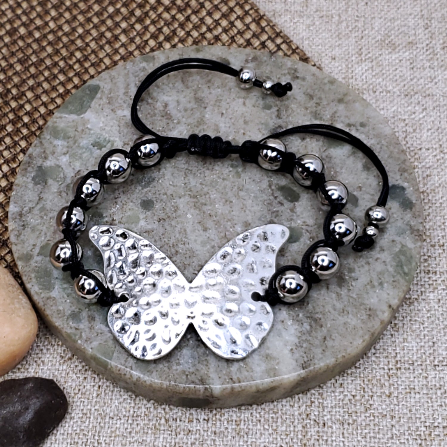 Silver hammered butterfly focal charm adjustable black bracelet. 