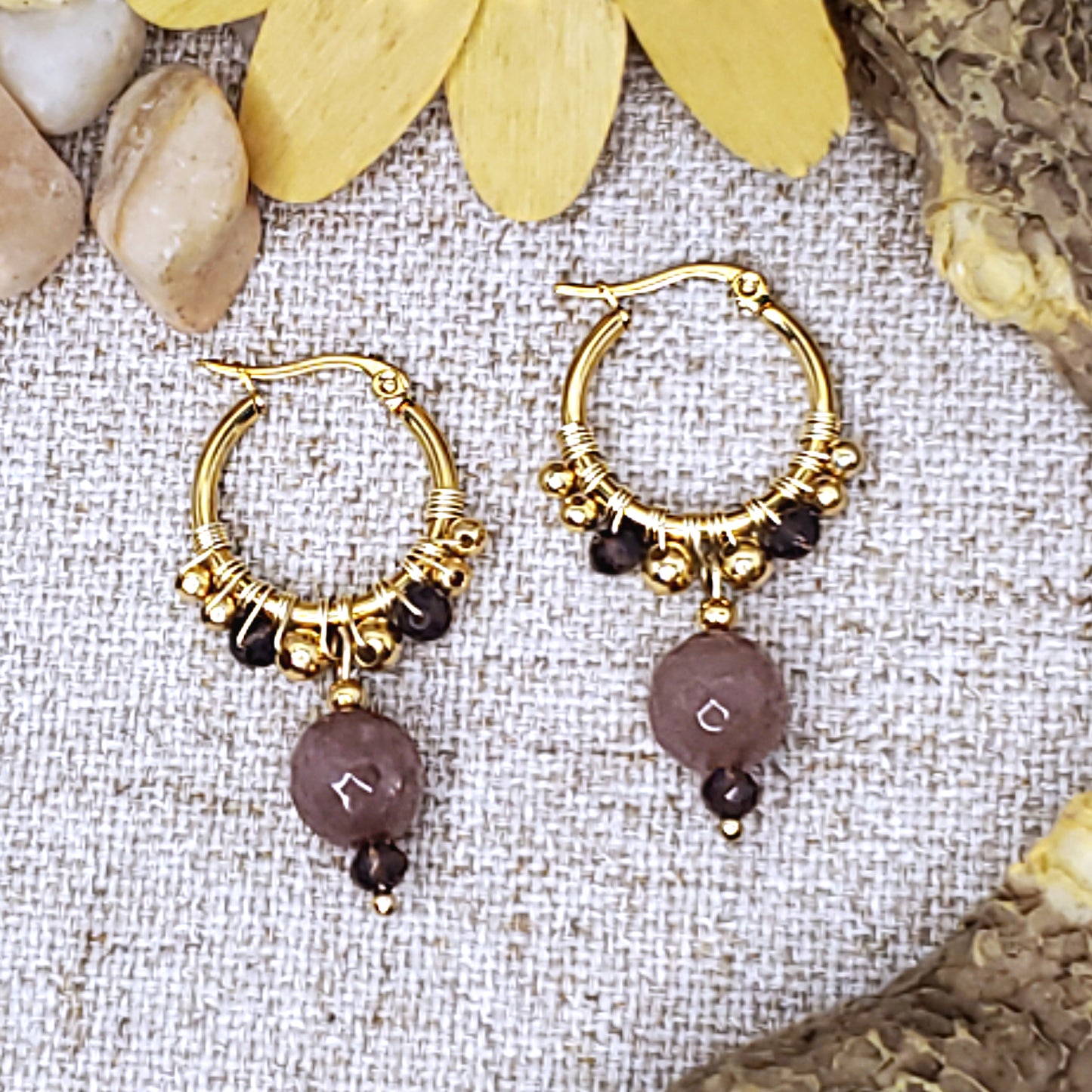 Small gold  hoop earrings with faceted mauve jade bead. 