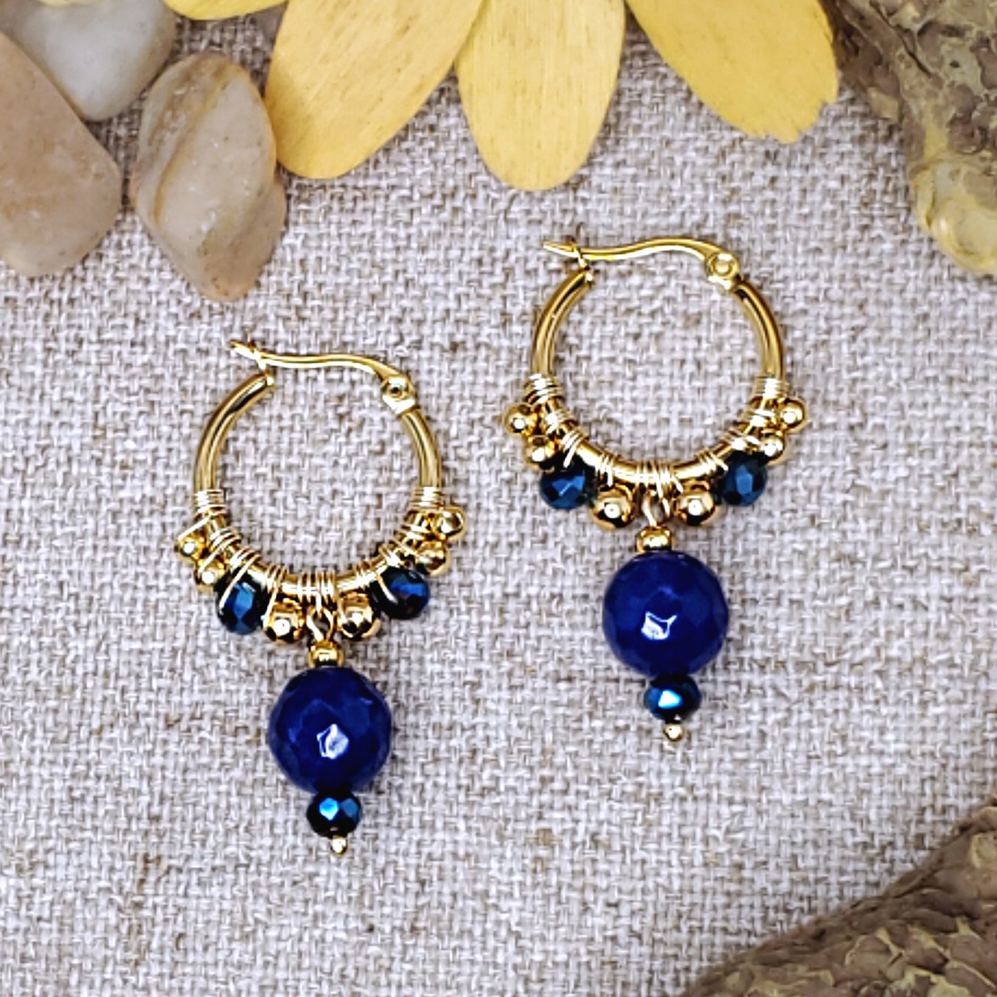 Small gold  hoop earrings with faceted royal blue jade bead. 