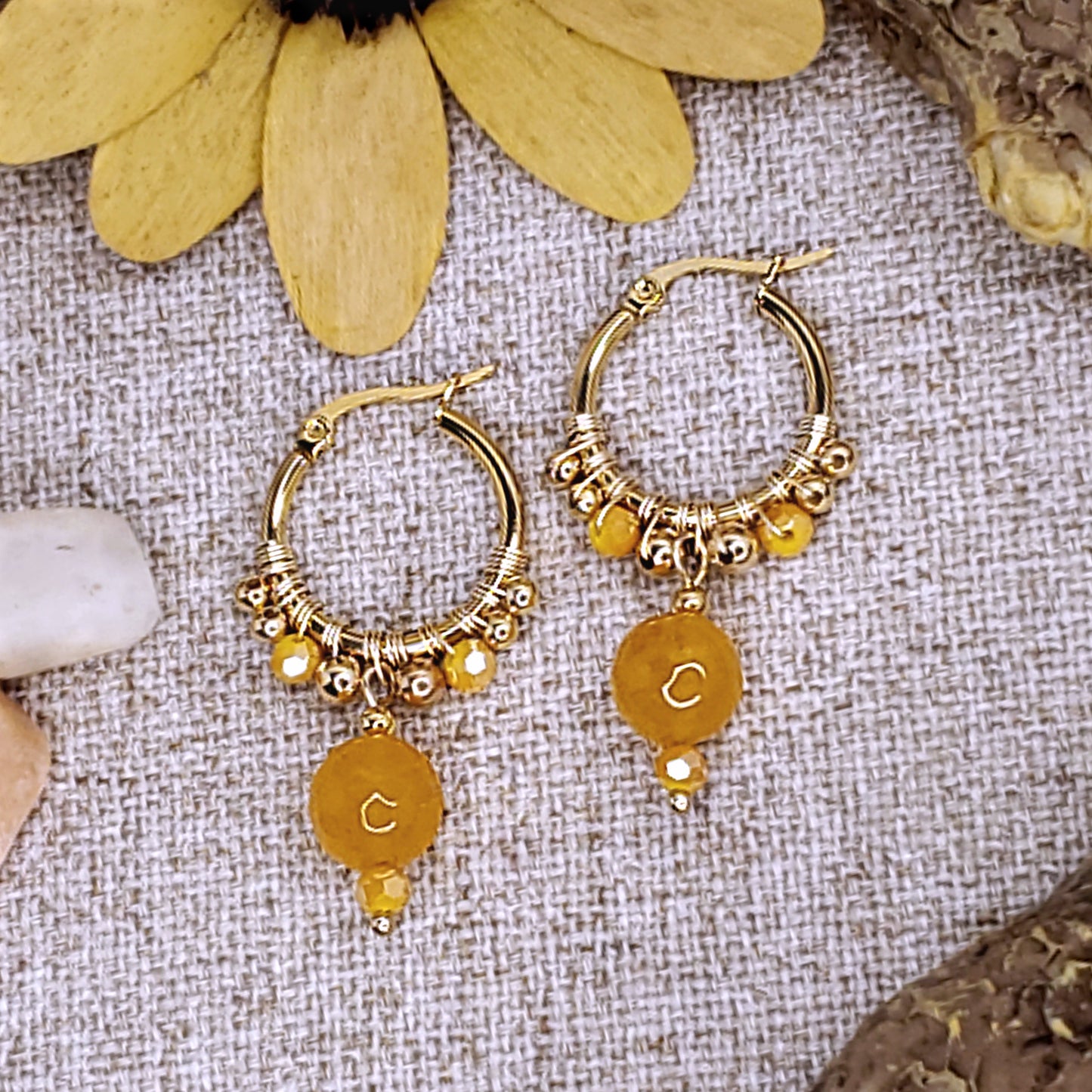 Small gold  hoop earrings with faceted yellow jade bead. 