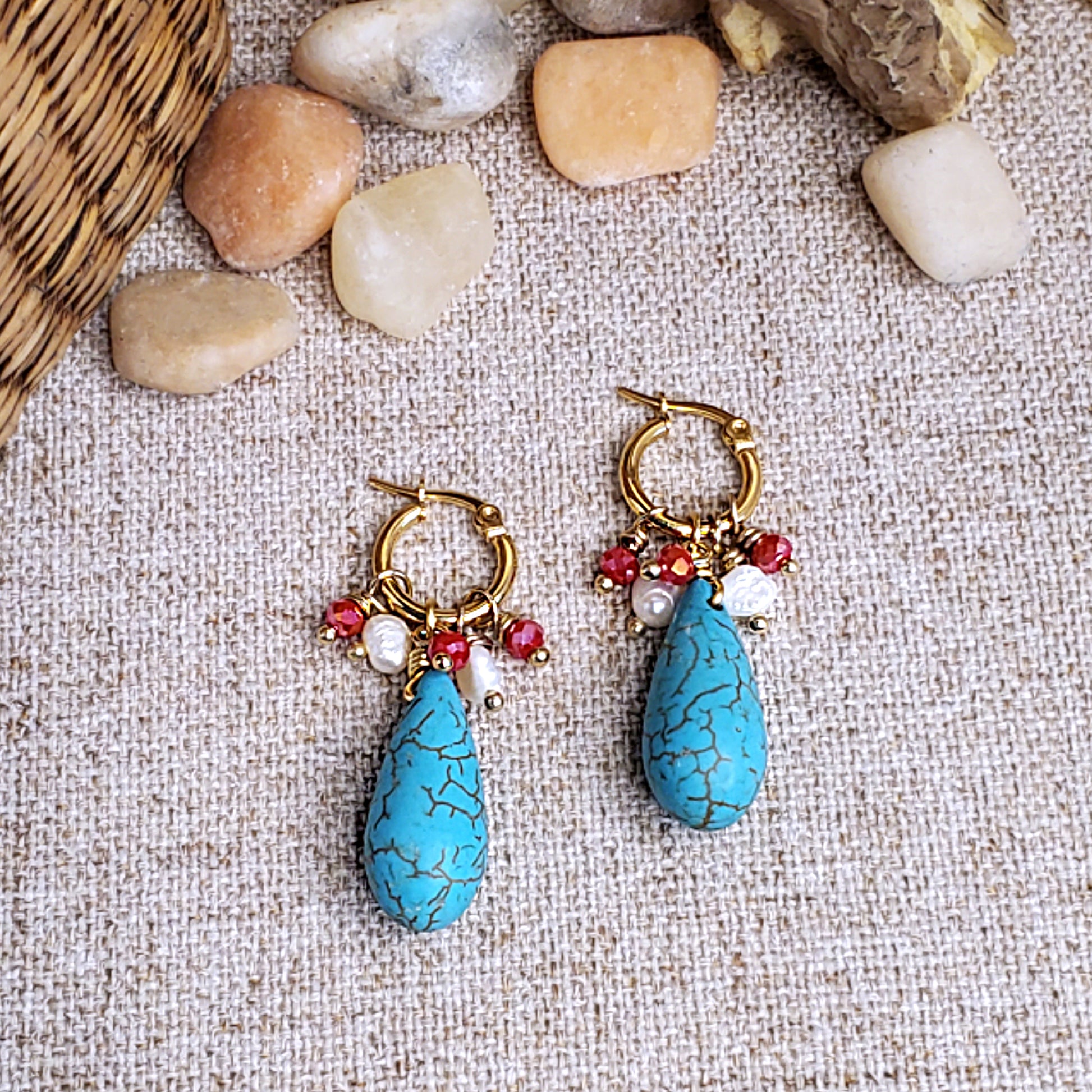 Gold earring hoops with red crystals, fresh water pearls and howlite teardrop bead.